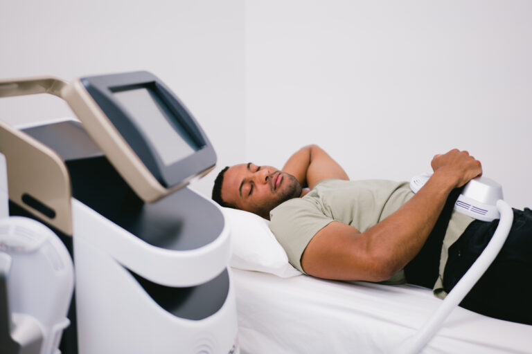 Man comfortably lied down during EMS Therapy session