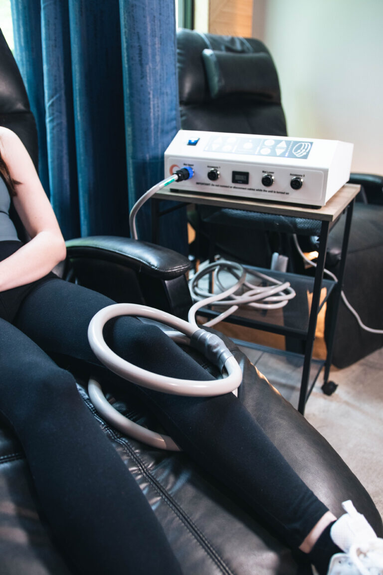 PEMF machine currently used on the woman's left knee