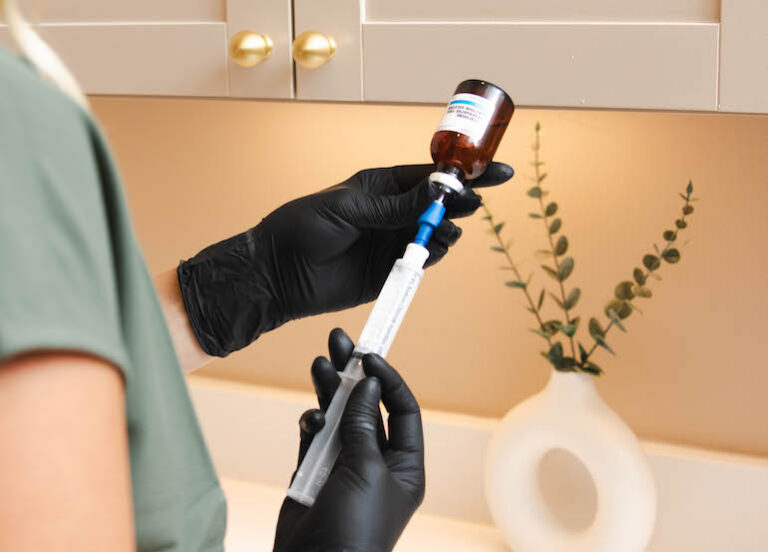 Nurse green uniform is preparing a Peptide injection